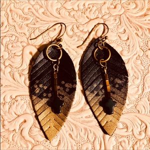 BLACK FEATHER EARRINGS WITH BLACK CROSSES